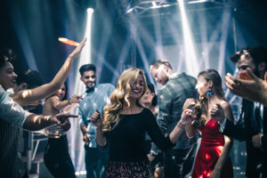 Photo of young people dancing in a nightclub
