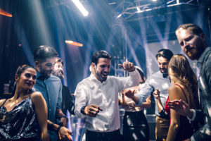 Photo of young people dancing in a nightclub